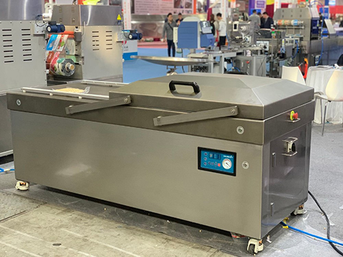 Double chamber vacuum packing machine